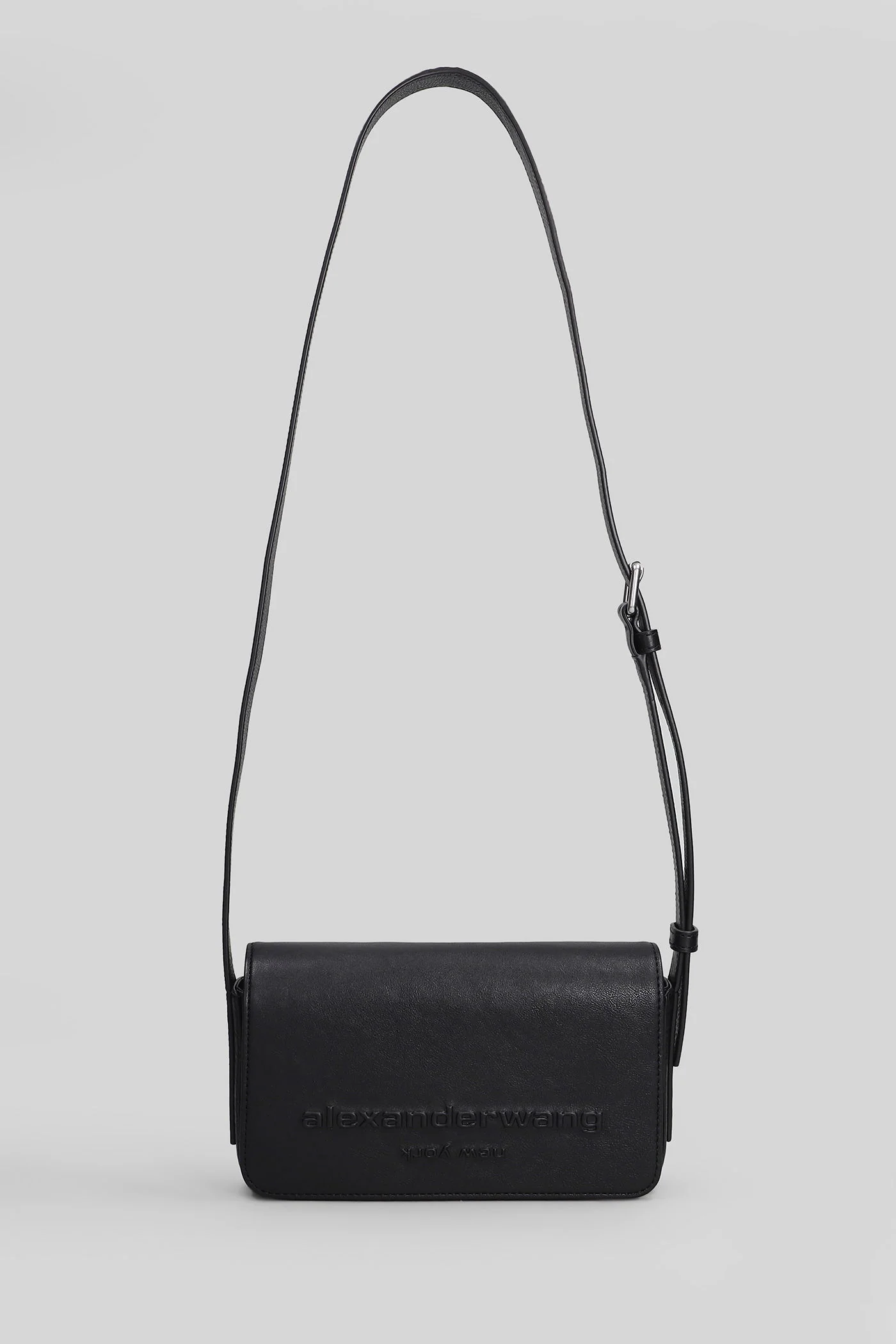 Punch flap Shoulder bag in black leather