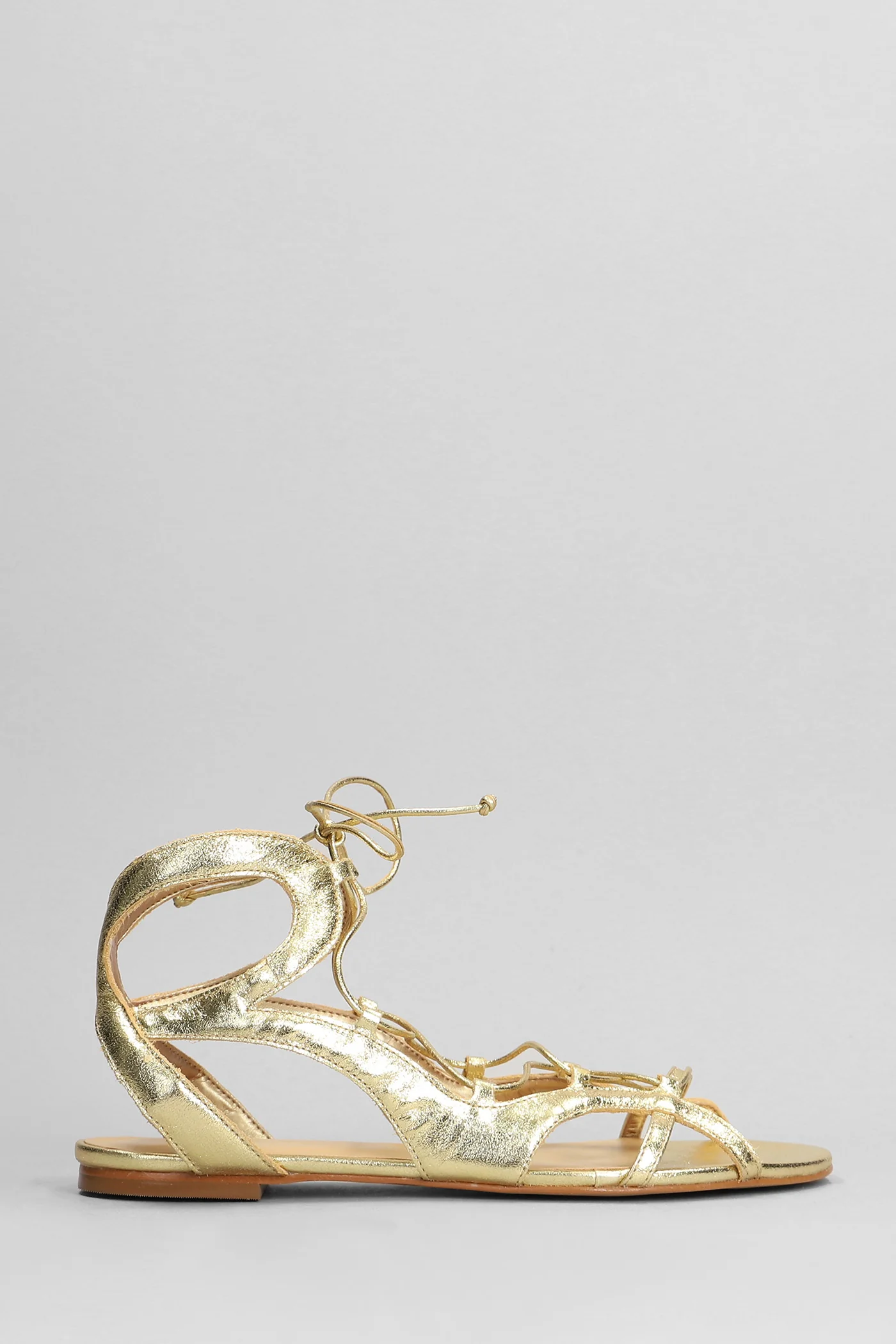 Flats in gold leather