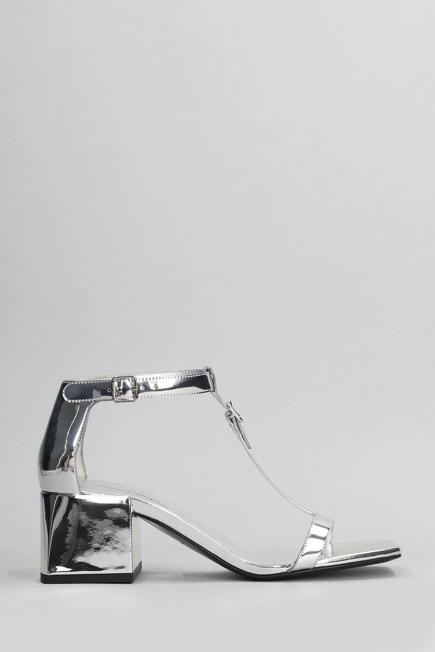Sandals in silver patent leather
