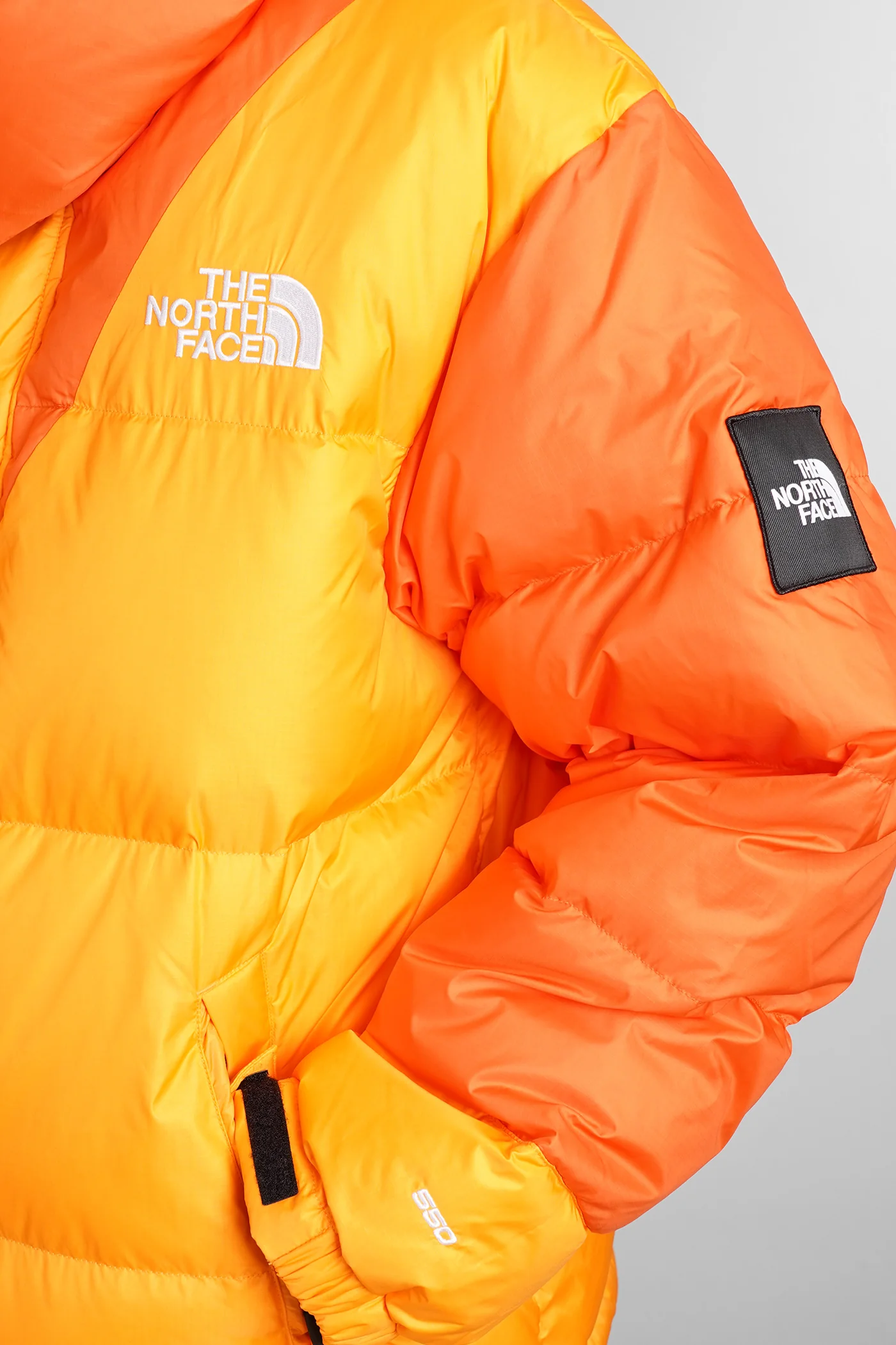 Tnf X Yi Down puffer in orange leather - Image 4