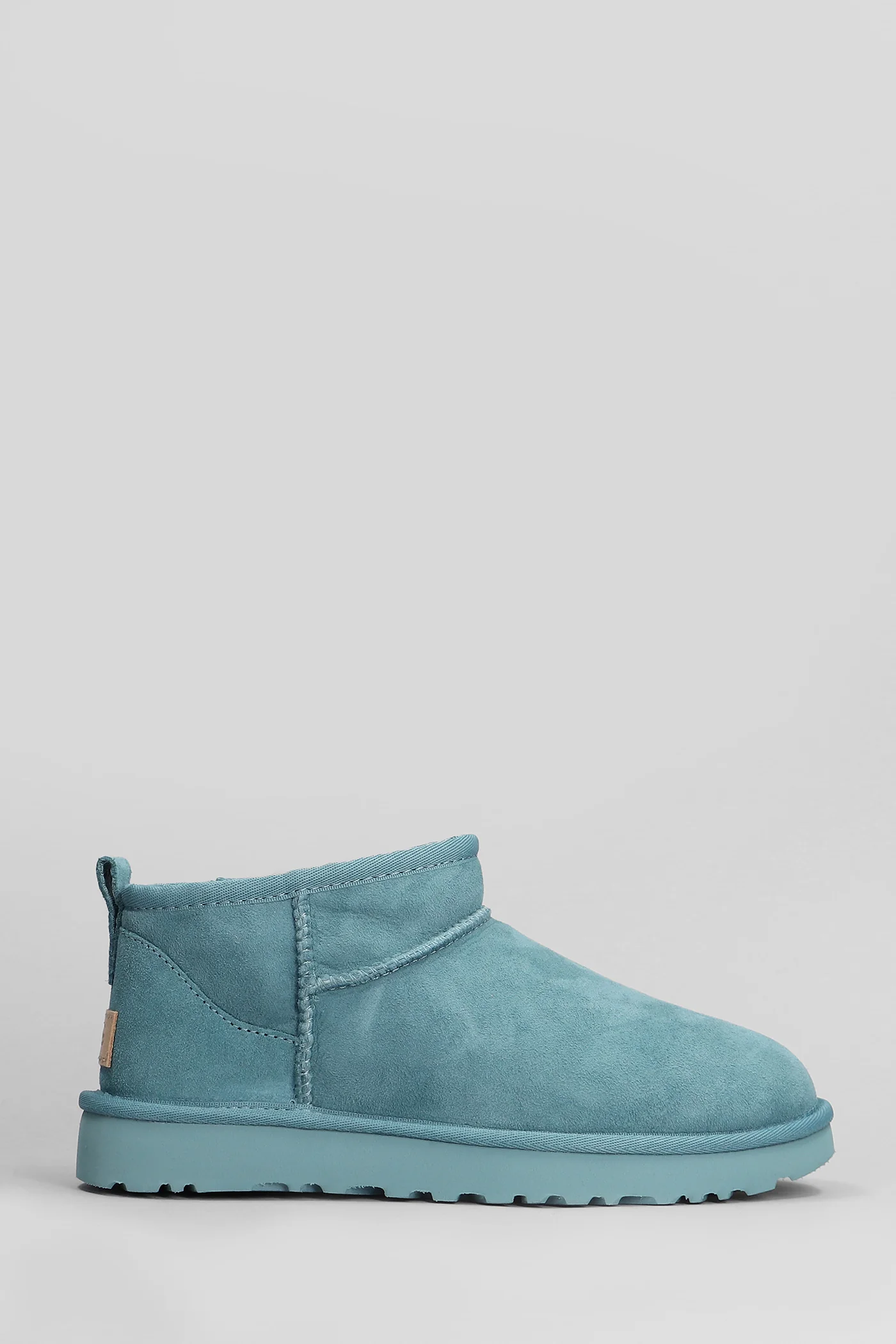 Classic Ultra Mini low heels Ankle boots in petroleum suede